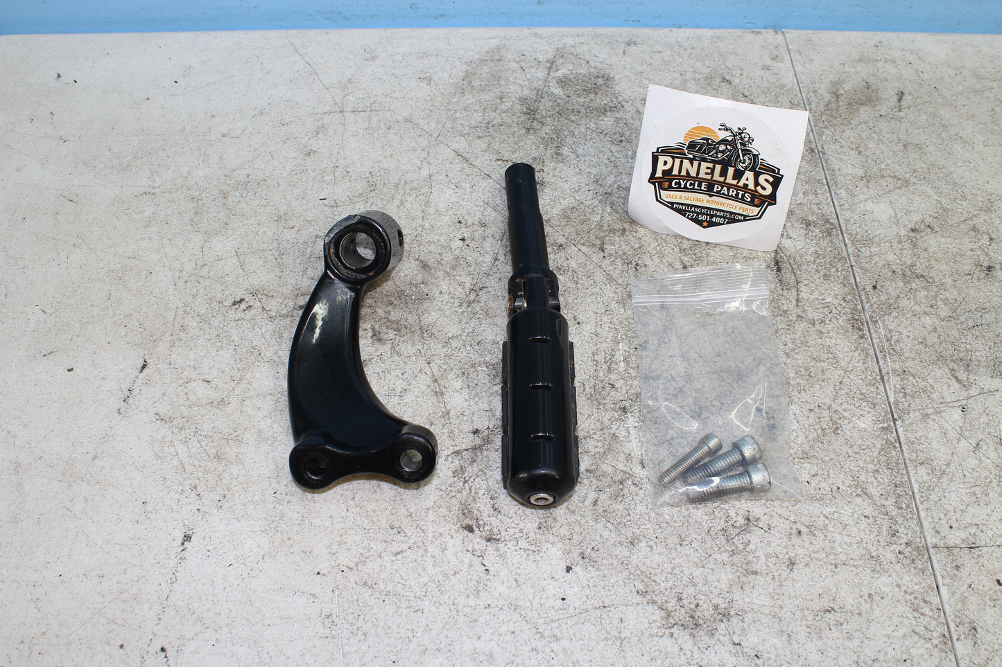 2014-2022 Harley Davidson Sportster 883 Left Driver Foot Peg w/ Mounting Bracket