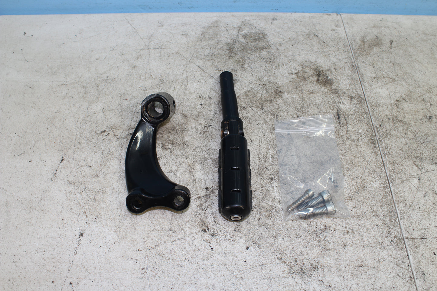 2014-2022 Harley Davidson Sportster 883 Left Driver Foot Peg w/ Mounting Bracket