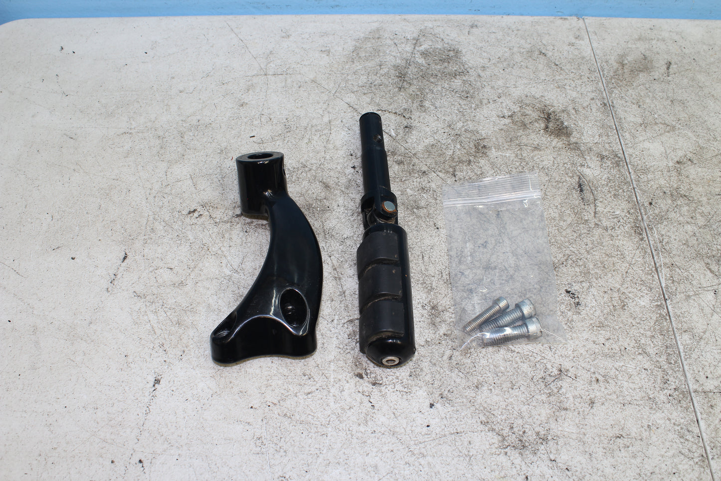 2014-2022 Harley Davidson Sportster 883 Left Driver Foot Peg w/ Mounting Bracket